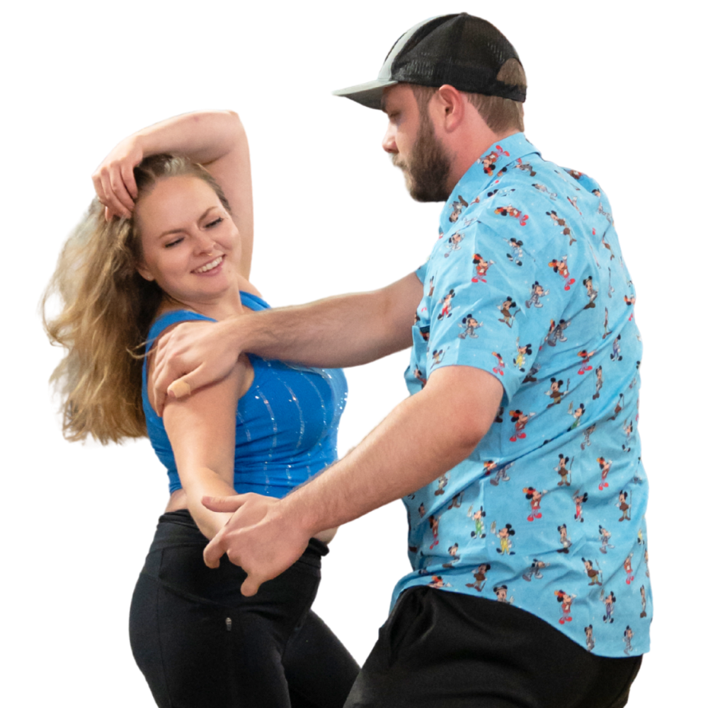 Two dancers performing West Coast Swing at a WOW event